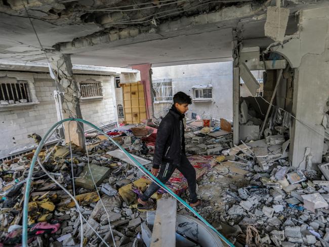 Palestinian citizens carry out search and rescue operations amid the destruction caused by Israeli air strikes in Khan Yunis, Gaza. Picture: Getty Images