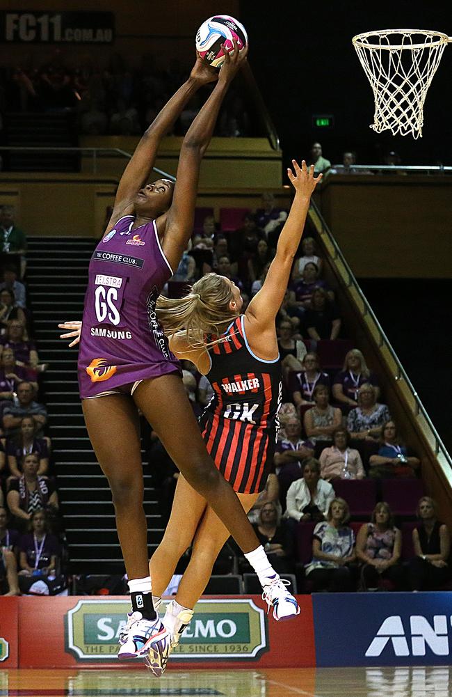 Romelda Aiken battles Zoe Walker for the ball in the opening round of the season.