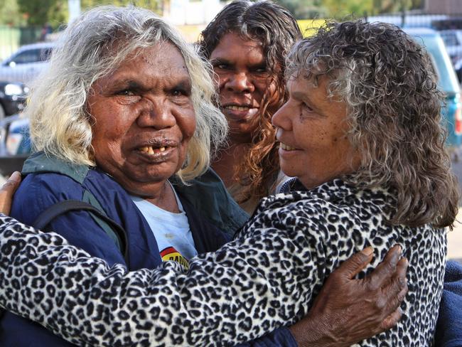 Happy with the result ... traditional owners of Muckaty Station, Doris Kelly, Gladys Brown and Elaine peckham embrace after the announcement that the planned radioactive waste dump was abandoned. Picture: Phil Williams