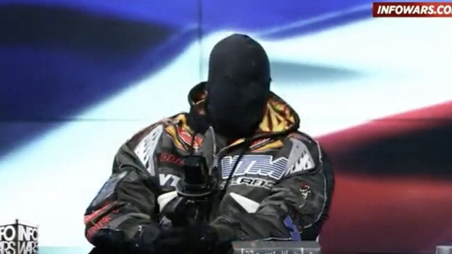 Kanye West, wearing a black fabric mask over his face, appearing on Alex Jones panel show. Picture: Infowars