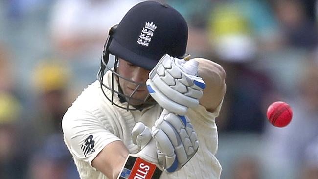 Chris Woakes takes evasive action as a short ball rears up.