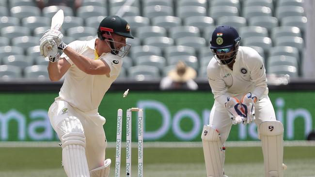 Australia's Shaun Marsh drags the ball onto his stumps. Picture: AP