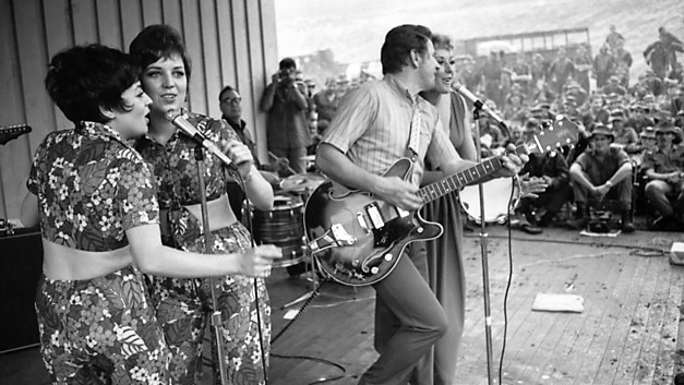 1969: Anne and Sue Wills perform in Vietnam with Johnny Mac and Lorrae Desmond.