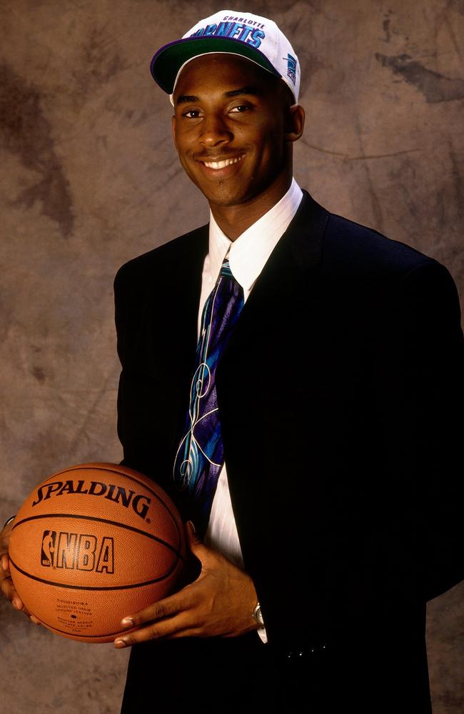 Kobe Bryant poses for a portrait after being selected by the Charlotte Hornets in the first round of the 1996 NBA Draft on June 26, 1996 at Madison Square Garden in New York. Picture: Getty