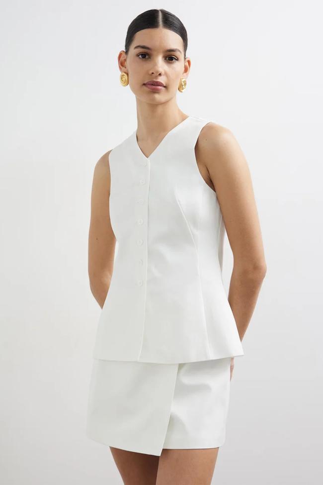 LoverBodie Longline VestThis chic white vest from Lovers is as professional as it gets whilst still being wearable enough for the heat of the season, and stylish to boot.Type: Vest | Material: Cotton, lyocell, polyester, viscose | Colour: White, black | Delivery: Free over $75Shop now for $90 (was $180)