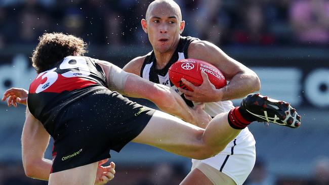 Alex Woodward pushes off Essendon's Heath Hocking in a VFL game early last season. Picture: Michael Klein