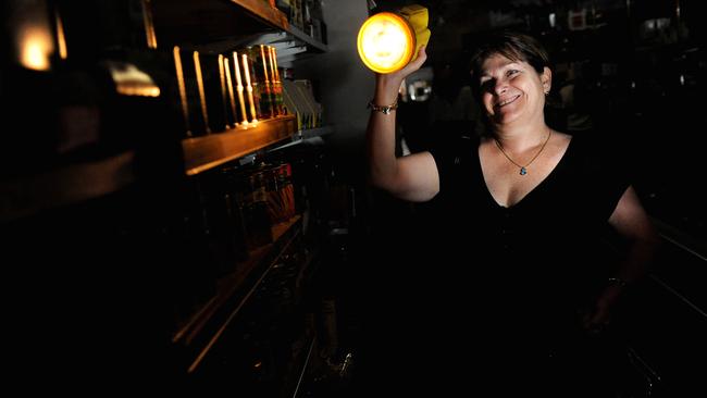 A 2014 blackout in the Parap area forced Parap Fine Foods to supply shoppers such as Leonore Morton with torches to do their shopping.