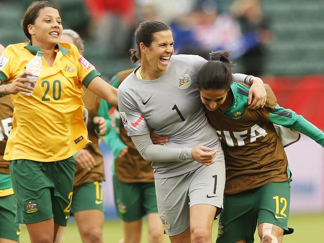 Lydia Williams #1 is flanked by Sam Kerr #20 and Leena Khamis.