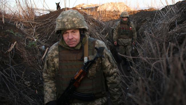 Ukrainian soldiers in a trench on the front line with Russia-backed separatists, near Novognativka village in the Donetsk region. Picture: AFP