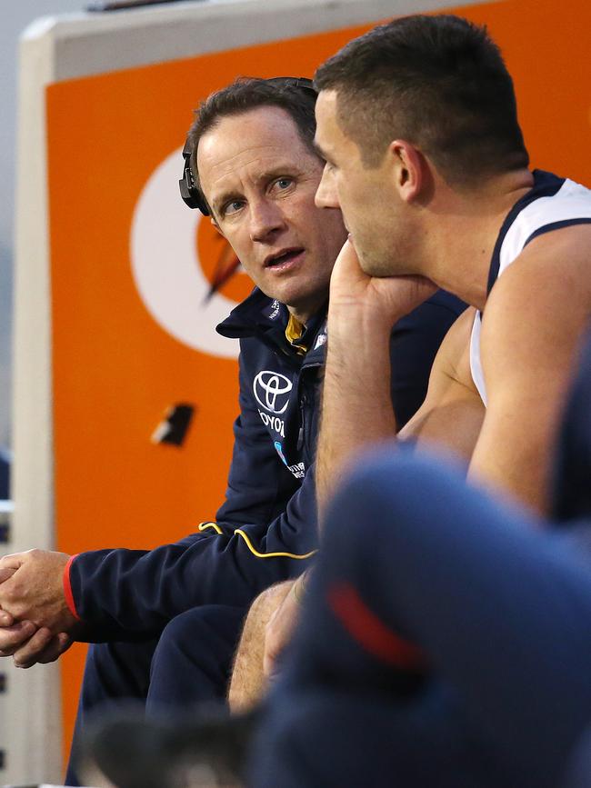 Adelaide coach Don Pyke talks with skipper Taylor Walker on the bench. Picture: Michael Klein