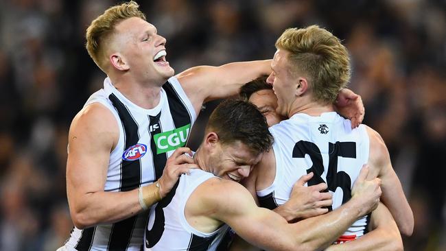 Collingwood players celebrate a late goal against the Tigers. Picture: Getty Images