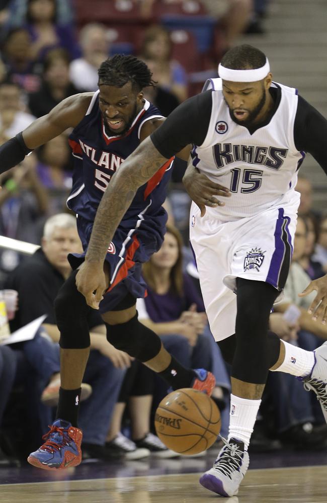 Atlanta Hawks forward DeMarre Carroll and Sacramento Kings centre DeMarcus Cousins.