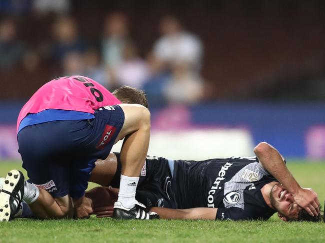 SYDNEY, AUSTRALIA - APRIL 06: Terry Antonis of the Victory lays down injured during the round 24 A-League match between Sydney FC and the Melbourne Victory at Sydney Cricket Ground on April 06, 2019 in Sydney, Australia. (Photo by Mark Metcalfe/Getty Images)