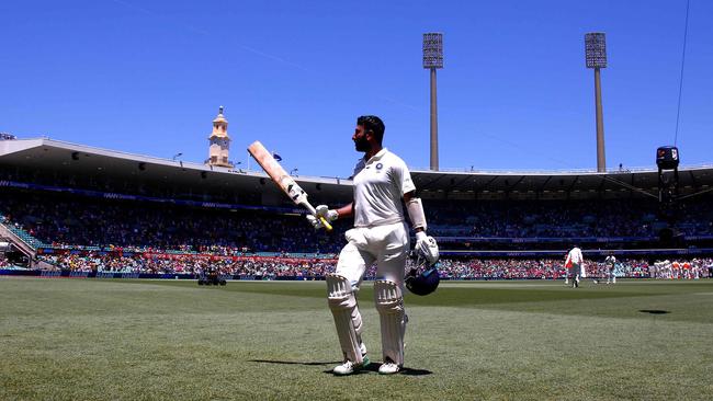 Cheteshwar Pujara salutes the SCG crowd after being dismissed for 193. Picture: AFP 