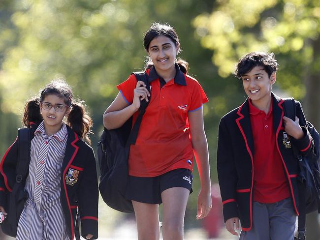 Kiri Burji with her children Hema, Harry and Hana Bains outside Ballarat Clarendon College,  Ballarat,   Picture Yuri Kouzmin