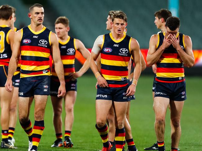 ADELAIDE, AUSTRALIA - JULY 20: Taylor Walker of the Crows and Matt Crouch of the Crows walk from the ground looking dejected during the round 7 AFL match between the Adelaide Crows and the St Kilda Saints at Adelaide Oval on July 20, 2020 in Adelaide, Australia. (Photo by Daniel Kalisz/Getty Images)