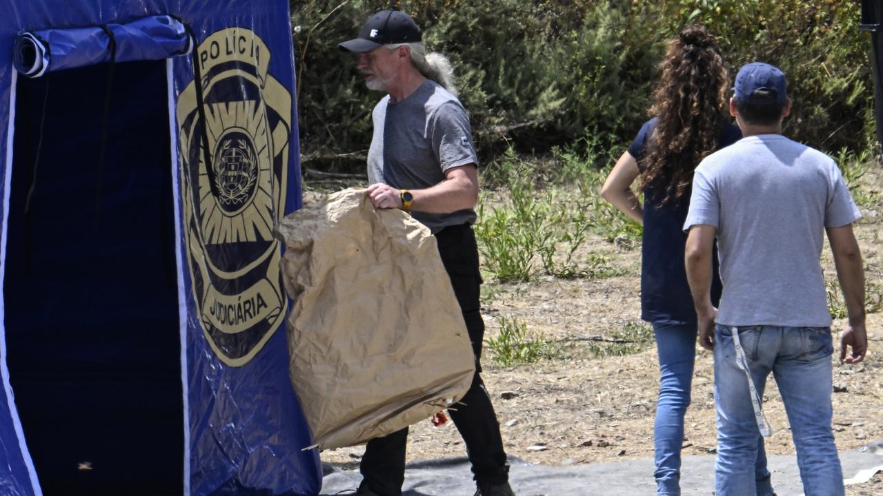 Search teams scoured the water from inflatable boats and sniffer dogs were deployed along the banks of the reservoir where officers dug along a bank adjacent to the water. Picture: Getty