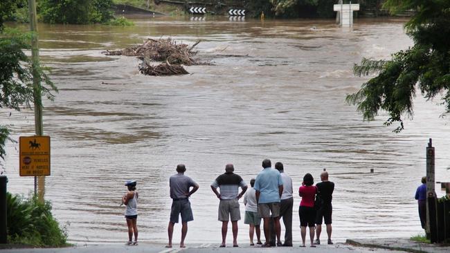 Scenes from swollen Bellinger River in January 2011 which flooded over the Lavenders Bridge, isolating North and South Bellingen. Photo Frank Redward