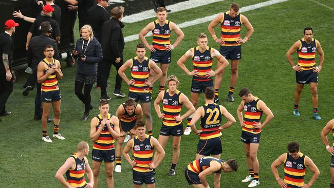 The dejected Crows after the final siren. Picture: Getty Images