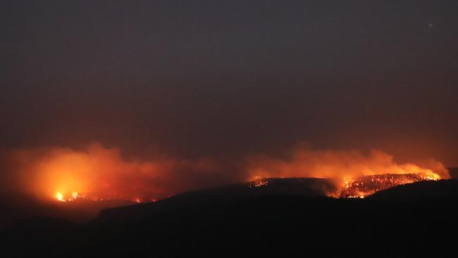 The view on Friday night from Echo Point at Bundanoon looking out on to Morton fire burning in the Southern Highlands. Picture: Richard Dobson