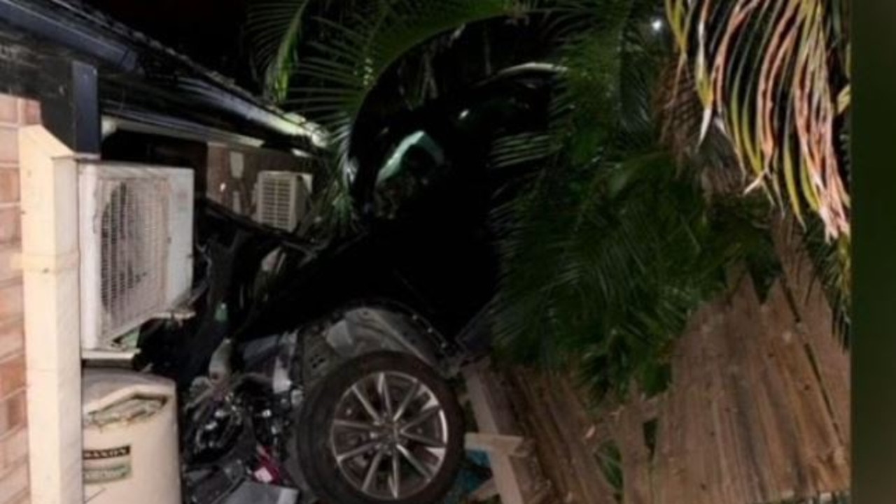 Wild scenes as car smashes into Brisbane house