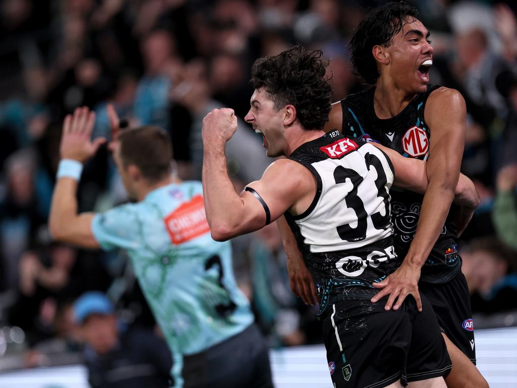 ADELAIDE, AUSTRALIA – MAY 19: Darcy Byrne-Jones and Jase Burgoyne of the Power celebrate the winning goal during the 2024 AFL Round 10 match between Yartapuulti (Port Adelaide Power) and the Hawthorn Hawks at Adelaide Oval on May 19, 2024 in Adelaide, Australia. (Photo by James Elsby/AFL Photos via Getty Images)
