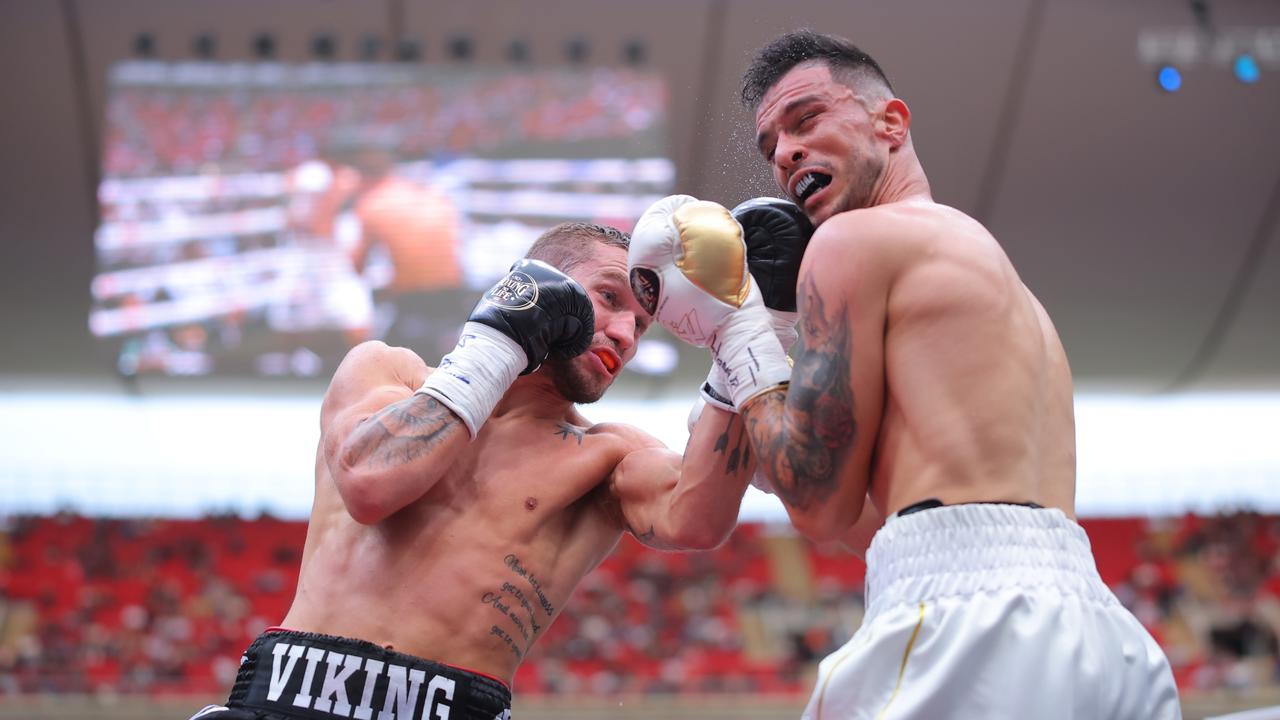 Steve Spark of Australia punches Gabriel Gollaz of Mexico during the fight for their WBA Inter-Continental Super Light title at Akron Stadium. Picture: Getty Images