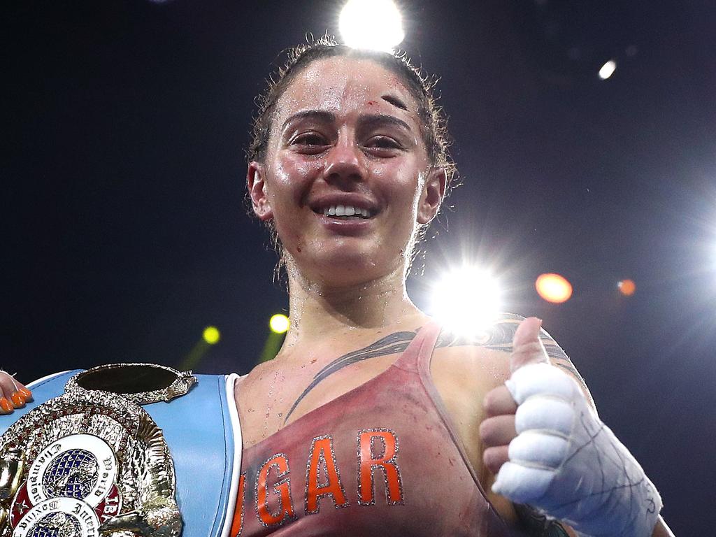 Johnson, her cut and the IBF world title. Picture: Kelly Defina/Getty Images)