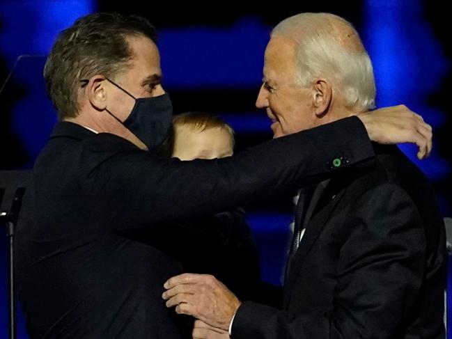 (FILES) In this file photo taken on November 07, 2020 US President-elect Joe Biden (R) embraces his son Hunter Biden (L) on stage after delivering remarks in Wilmington, Delaware. - US President-elect Joe Biden's son Hunter, a frequent target of Republican attacks during the 2020 election campaign, said December 9, 2020, he is under investigation for potential tax violations. (Photo by Andrew Harnik / POOL / AFP)