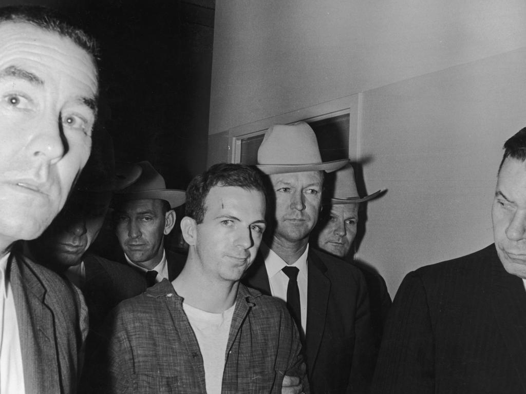 Lee Harvey Oswald is taken into custody by police after shooting President John F Kennedy in Dallas. Picture: Getty Images