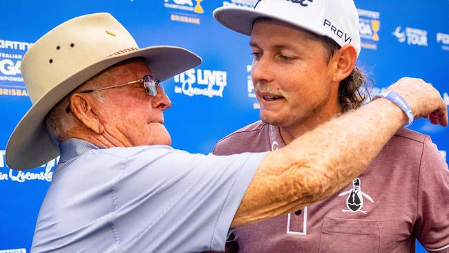 Cameron Smith is embraced by his grandfather Eric Smith following the final round. Picture: AFP