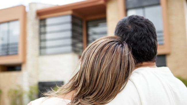 Generic photo of an Australian couple looking at property