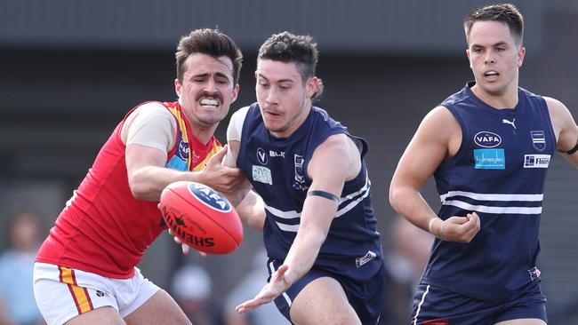 Caulfield Grammarians and Old Scotch players battle for the ball. Picture: David Crosling