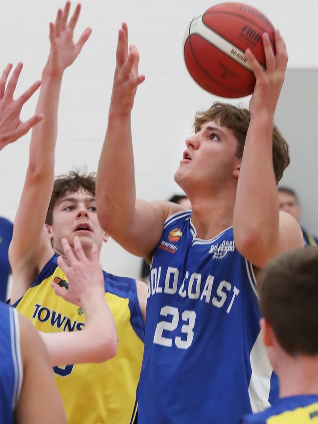 Basketball Queensland Under-16 Boys State Championships at the Coomera Indoor Sports Centre. Gold Coast Rollers (blue) v Townsville Heat Division 1 game . Rollers Nikos Karathanasopoulos (23) and Heats Regan Blachford (9) Picture Glenn Hampson