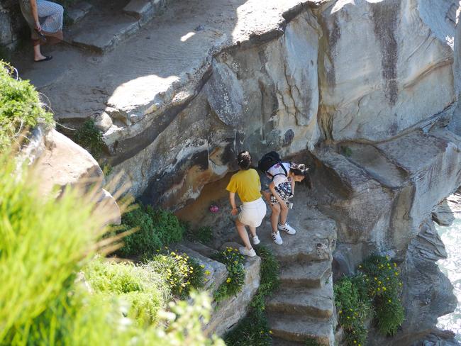 Residents say “about 500 people” descended on the reserve over the Easter weekend and that heritage sandstone walls were being “pushed over one block at a time”. 