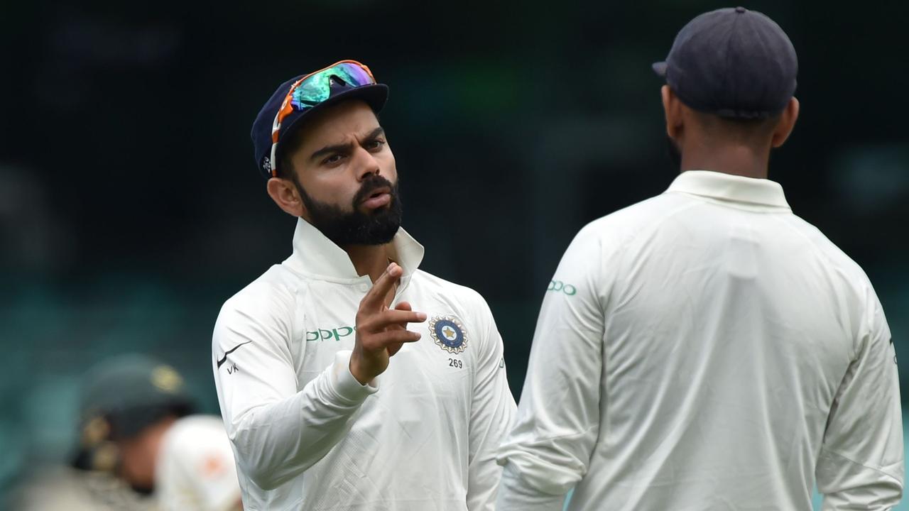 India's captain Virat Kohli (L) talks to Cheteshwar Pujara (R) whilst fielding on the third day of the tour match against Cricket Australia XI at the SCG in Sydney on November 30, 2018. (Photo by PETER PARKS / AFP) / -- IMAGE RESTRICTED TO EDITORIAL USE - STRICTLY NO COMMERCIAL USE --