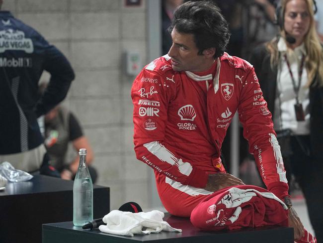 Ferrari's Spanish driver Carlos Sainz Jr. looks on after the qualifying session for the Las Vegas Formula One Grand Prix on November 18, 2023, in Las Vegas, Nevada. (Photo by Darron Cummings / POOL / AFP)