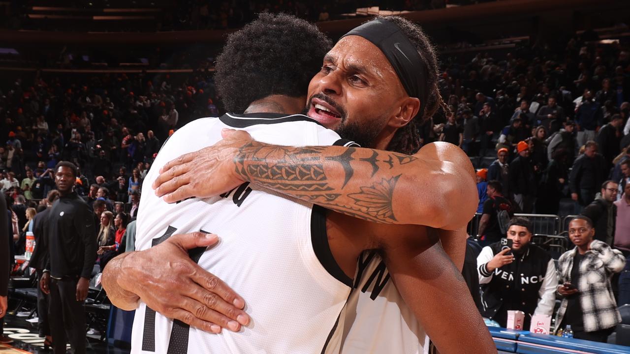 Patty Mills celebrates with teammate Kyrie Irving after the Nets’ win. Picture: Nathaniel S. Butler/NBAE via Getty Images