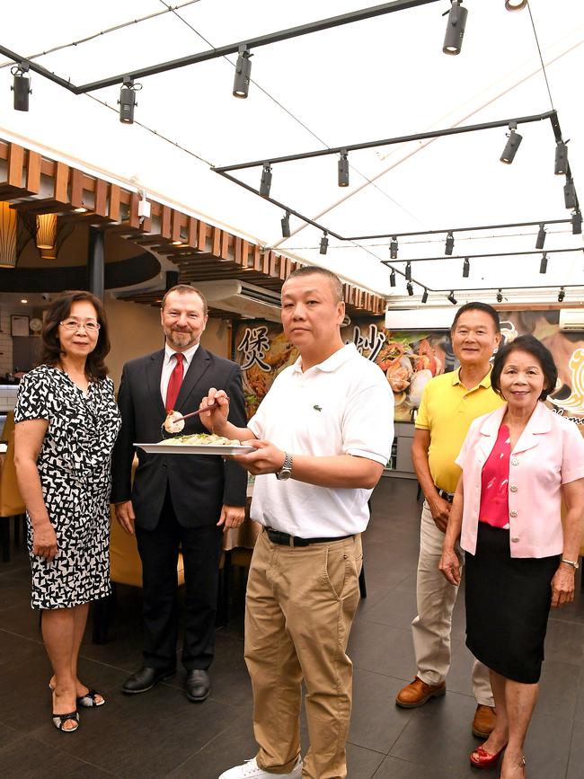 Tracy Lin, Member for Moreton Graham Perrett, Glamorous Wok owner Jacky Lee, Steve Hsu and Florence Day urge the community to support businesses in Sunnybank doing it tough since the coronavirus outbreak. Picture: John Gass/AAP