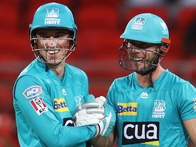 Tom Banton of the Heat celebrates scoring his half century with team mate Chris Lynn of the Heat during the Big Bash League (BBL) cricket match between Sydney Thunder and Brisbane Heat at Spotless Stadium in Sydney, Monday, January 6, 2020. (AAP Image/Brendon Thorne) NO ARCHIVING, EDITORIAL USE ONLY, IMAGES TO BE USED FOR NEWS REPORTING PURPOSES ONLY, NO COMMERCIAL USE WHATSOEVER, NO USE IN BOOKS WITHOUT PRIOR WRITTEN CONSENT FROM AAP