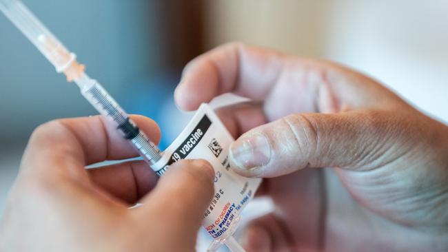 Nurses prepare Pfizer-BioNTech COVID-19 vaccines in a Melbourne hospital. Picture: Asanka Ratnayake/Getty Images