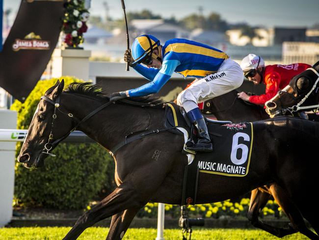 Kerrin McEvoy raises his whip as Music Magnate takes out the Doomben 10,000. Picture: AAP