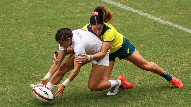 Nicole Heavirland is tackled by Charlotte Caslick. Picture: Getty Images