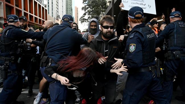 Protesters clash with NSW Police officers at Town Hall during an anti-lockdown rally in Sydney. Picture: NCA NewsWire/Bianca De Marchi