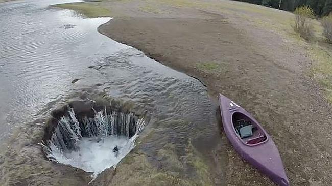 Watch lake vanish into giant hole