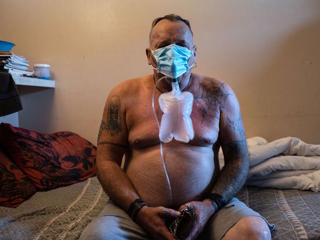 HOUSTON, TEXAS - AUGUST 17: A man with suspected Covid-19 symptoms breathes in oxygen as EMS medics with the Houston Fire department prepare to transport him to a hospital on August 17, 2021 in Houston, Texas. Texas' largest city is seeing a major surge of the Delta variant of the Coronavirus, taxing emergency personnel and overwhelming city hospitals.   John Moore/Getty Images/AFP == FOR NEWSPAPERS, INTERNET, TELCOS & TELEVISION USE ONLY ==