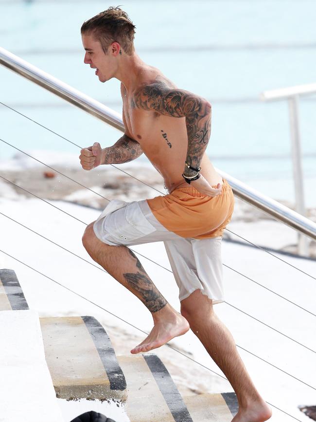 Justin Bieber spotted swimming at Bondi Iceberg in Sydney. Picture: KHAPGG/Matrix