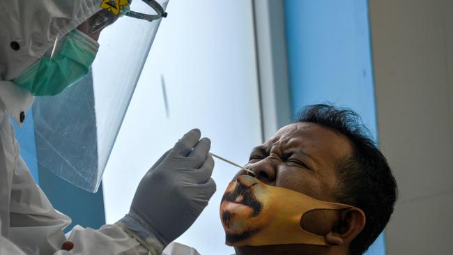 COVID-19 testing in Indonesia, where infections are on the rise. Picture: AFP