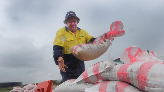 Gold Coast city Council maintenance worker Geoff Toole keeping the sandbag pile topped up at the Bilinga sandbag depot. Picture: Glenn Hampson