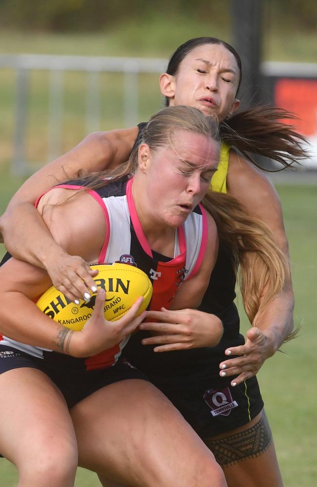 Womens AFL game between Curra Swans and Hermit Park Tigers at Murray. Swans Bonnie Farrell and Tigers Meagan Rickertt. Picture: Evan Morgan